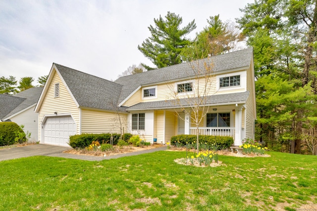 view of front of home with a porch, roof with shingles, a front yard, aphalt driveway, and an attached garage