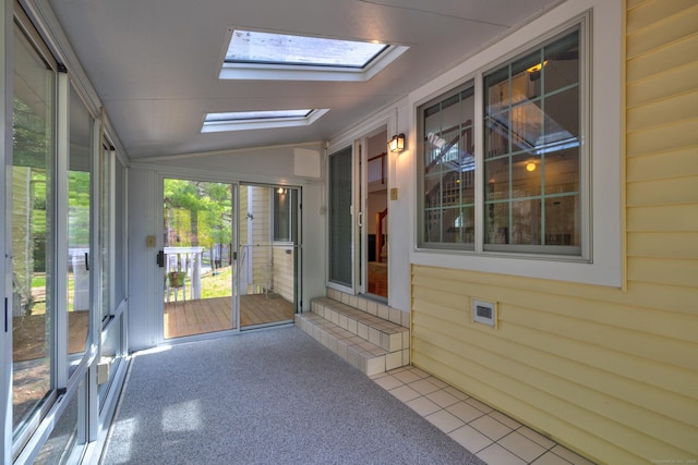 unfurnished sunroom with a skylight