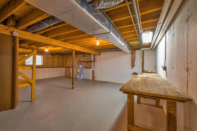 unfinished basement with water heater