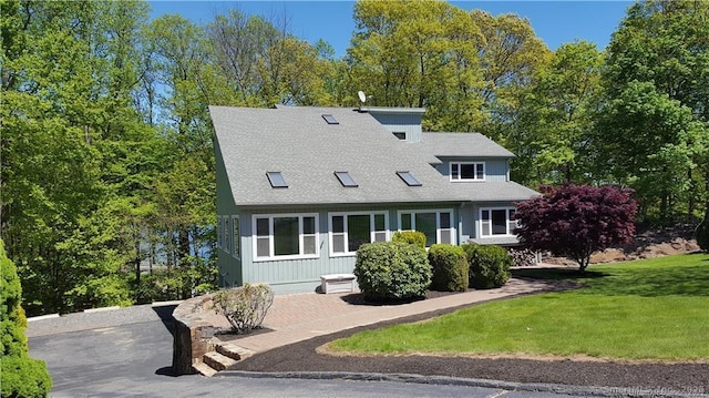 210 Founders Way, Stratford, CT 06614 - cape cod home featuring a shingled roof and a front lawn