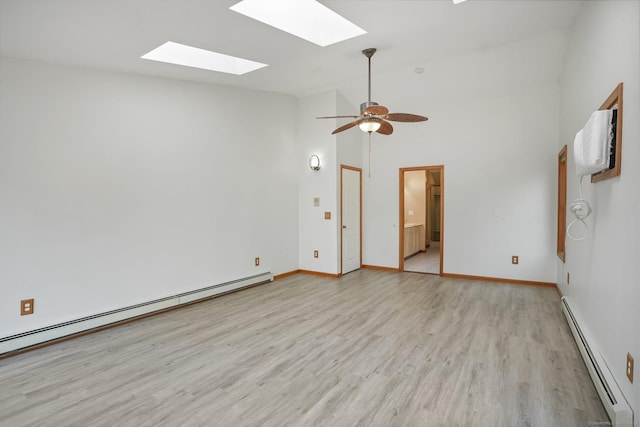 210 Founders Way, Stratford, CT 06614 - unfurnished room featuring light wood-type flooring, baseboards, lofted ceiling with skylight, and a baseboard radiator