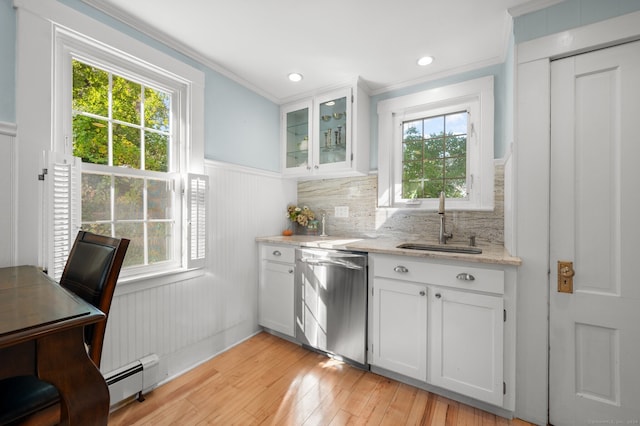 kitchen with light stone counters, a sink, light wood-type flooring, dishwasher, and white cabinetry