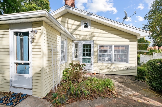 view of home's exterior featuring a chimney