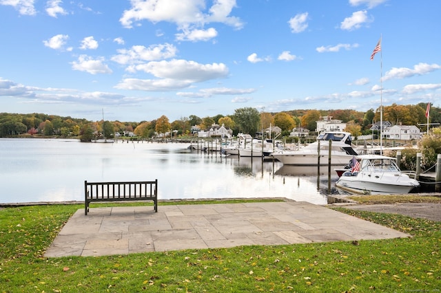 dock area featuring a yard and a water view