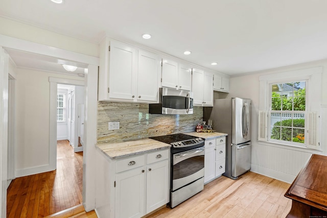 16 N Main St, Essex, CT 06426 - kitchen with stainless steel appliances, light wood-style flooring, white cabinets, plenty of natural light, and recessed lighting