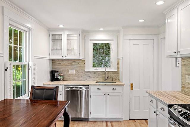 16 N Main St, Essex, CT 06426 - kitchen featuring appliances with stainless steel finishes, white cabinets, tasteful backsplash, ornamental molding, and recessed lighting