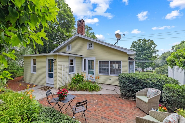 16 N Main St, Essex, CT 06426 - rear view of property with a patio and a chimney