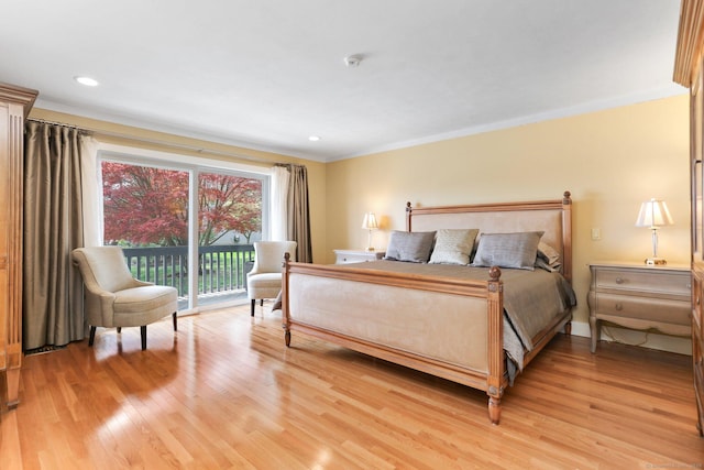 bedroom with access to outside, ornamental molding, recessed lighting, and light wood-style flooring