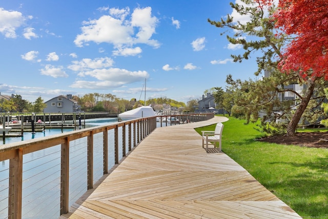 dock area featuring a lawn