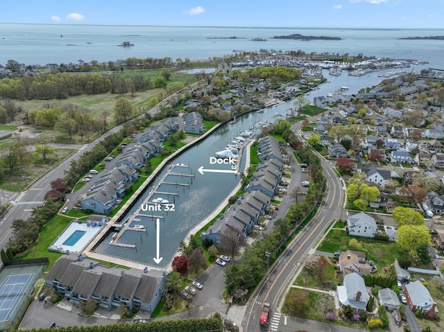 birds eye view of property with a residential view and a water view