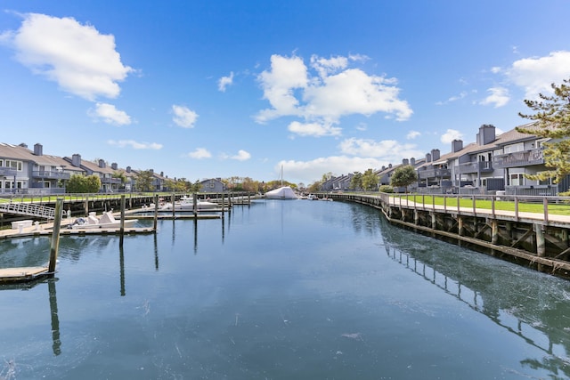 property view of water featuring a residential view and a dock