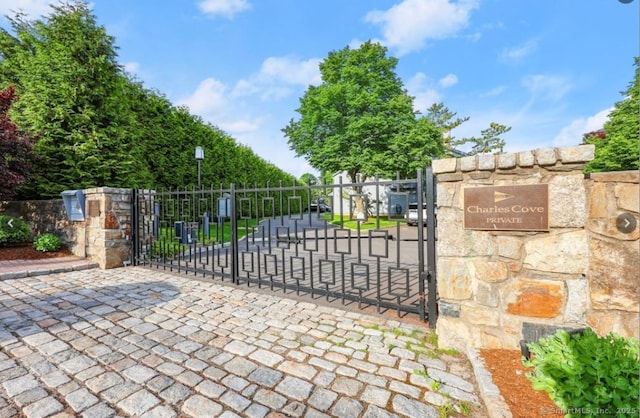 view of gate featuring fence