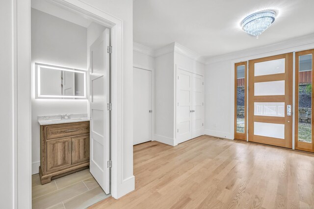 8 Fox Run, Monroe, CT 06468 - entrance foyer featuring ornamental molding, baseboards, and light wood-type flooring