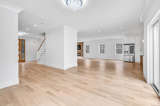 8 Fox Run, Monroe, CT 06468 - unfurnished living room featuring ornamental molding, recessed lighting, stairway, light wood-style floors, and baseboards
