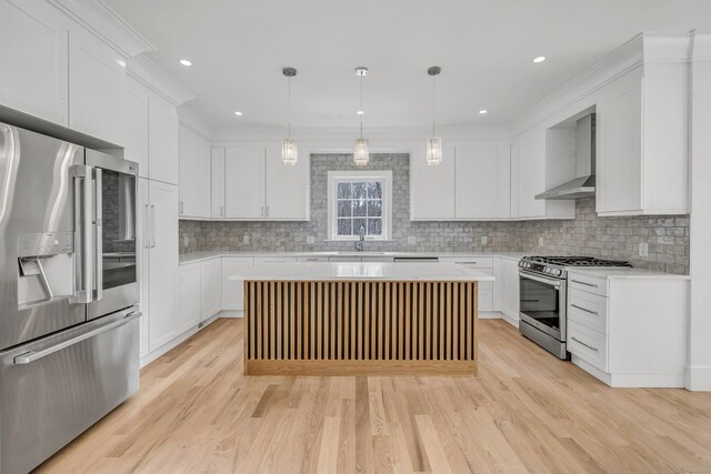8 Fox Run, Monroe, CT 06468 - kitchen featuring stainless steel appliances, wall chimney exhaust hood, a sink, light countertops, and light wood-style floors