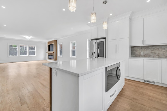 8 Fox Run, Monroe, CT 06468 - kitchen with stainless steel appliances, crown molding, open floor plan, light wood-style flooring, and recessed lighting