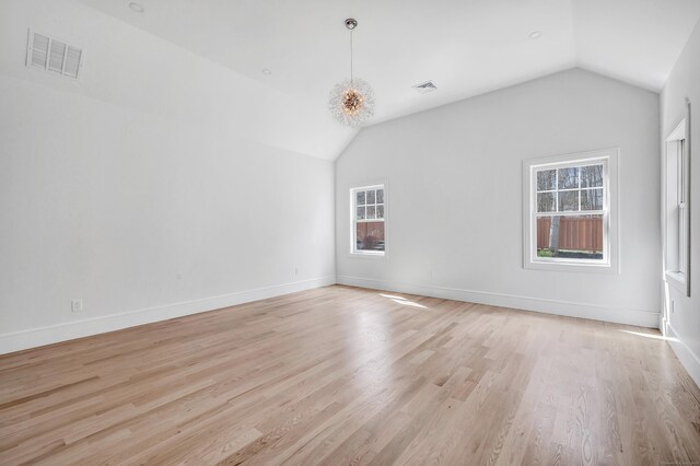 8 Fox Run, Monroe, CT 06468 - spare room featuring vaulted ceiling, light wood-type flooring, and baseboards