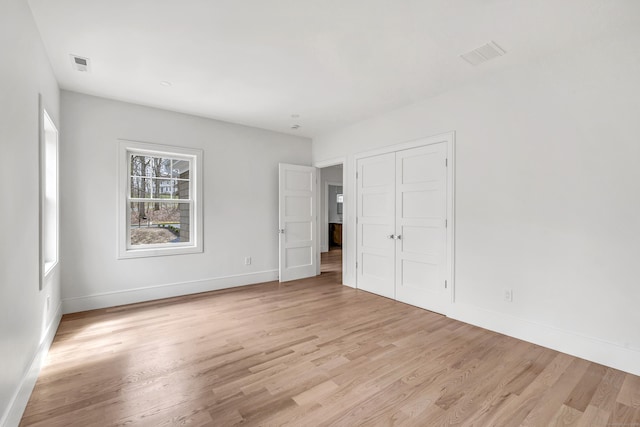 8 Fox Run, Monroe, CT 06468 - unfurnished bedroom featuring light wood-style flooring, baseboards, and a closet