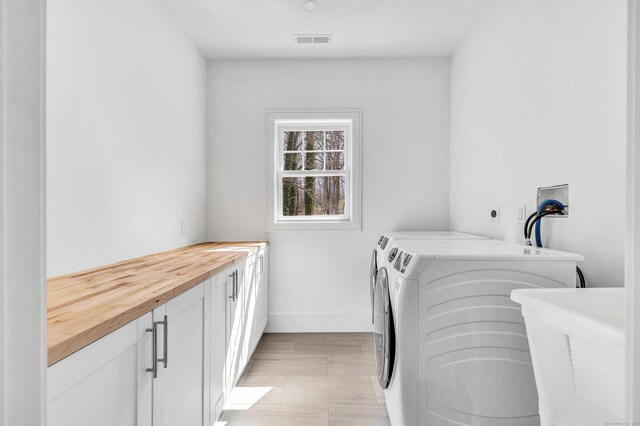 8 Fox Run, Monroe, CT 06468 - laundry area with cabinet space, separate washer and dryer, and baseboards