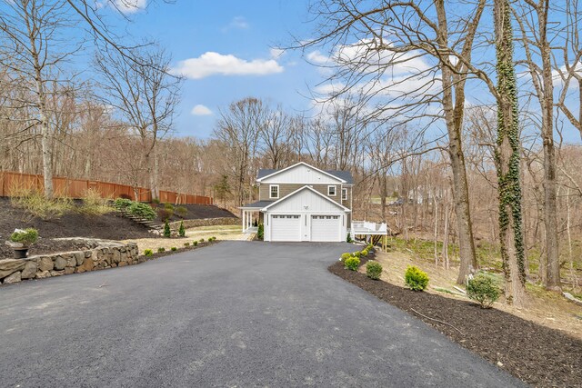 8 Fox Run, Monroe, CT 06468 - view of front facade featuring asphalt driveway and a garage