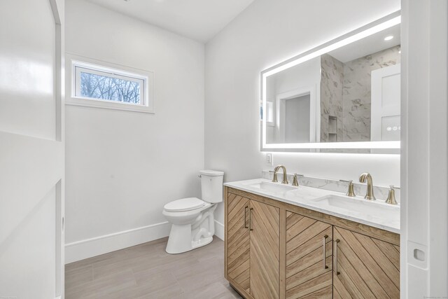 8 Fox Run, Monroe, CT 06468 - bathroom with double vanity, baseboards, and toilet