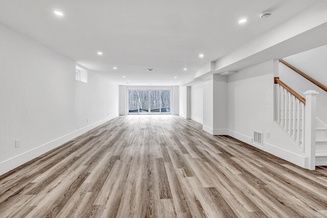 8 Fox Run, Monroe, CT 06468 - unfurnished living room with recessed lighting, baseboards, light wood-style floors, and stairs