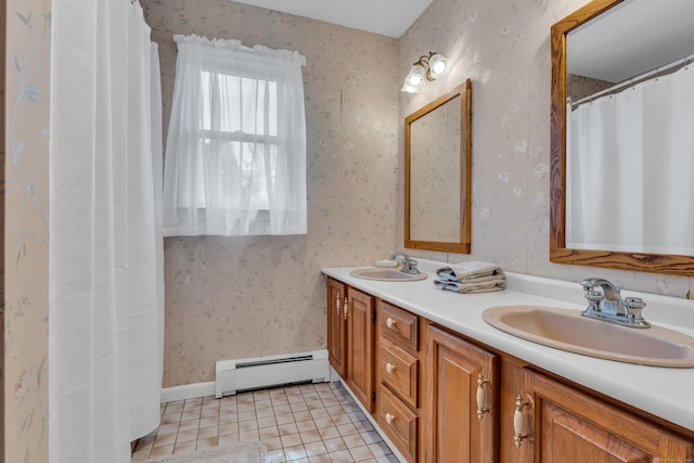 full bathroom featuring wallpapered walls, tile patterned floors, double vanity, a sink, and a baseboard radiator