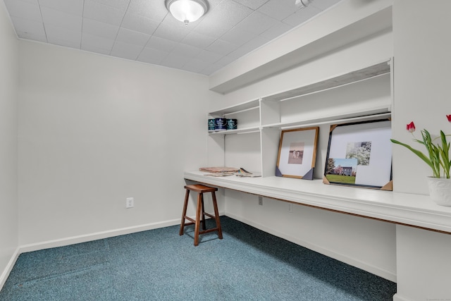 carpeted office space with baseboards