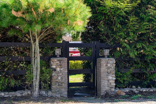 view of gate featuring fence
