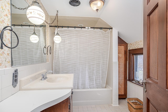 full bath featuring tile walls, shower / bath combination with curtain, tile patterned flooring, and vanity