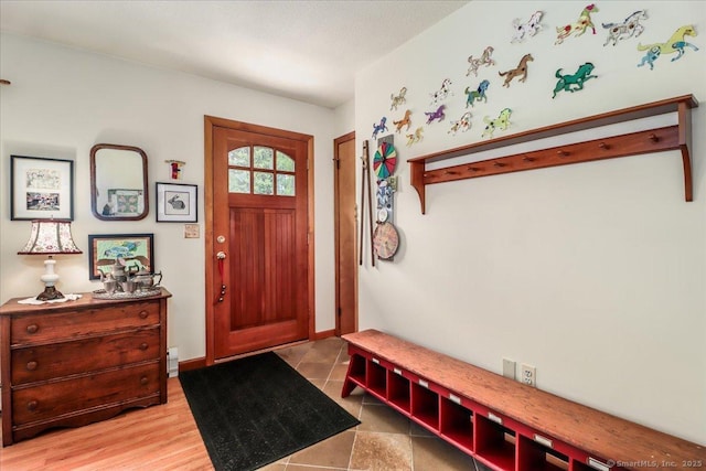 entryway featuring baseboards