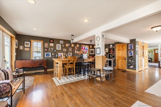 interior space featuring recessed lighting, wood finished floors, and a healthy amount of sunlight