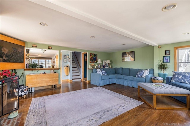 living room featuring wood finished floors, recessed lighting, and stairs