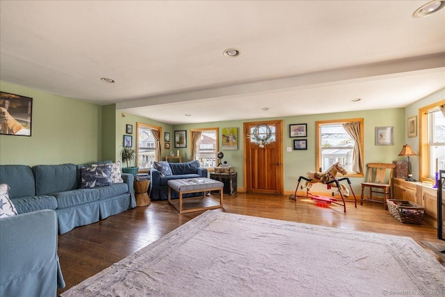 living room featuring wood finished floors, recessed lighting, and baseboards