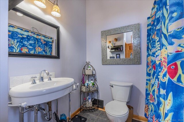 38 Elaine Rd, Milford, CT 06460 - bathroom with tile patterned floors and a shower with shower curtain
