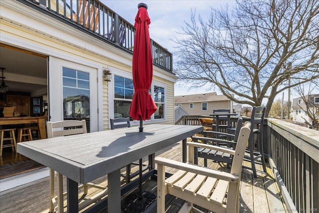 wooden terrace featuring outdoor dining area