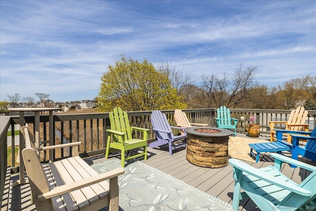 wooden deck with an outdoor fire pit