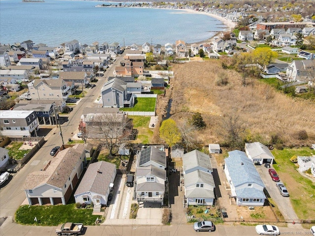 aerial view with a water view and a residential view