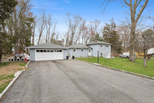 42 Stonecrop Rd, Norwalk, CT 06851 - view of front of house featuring a shingled roof, a front lawn, a chimney, and a garage
