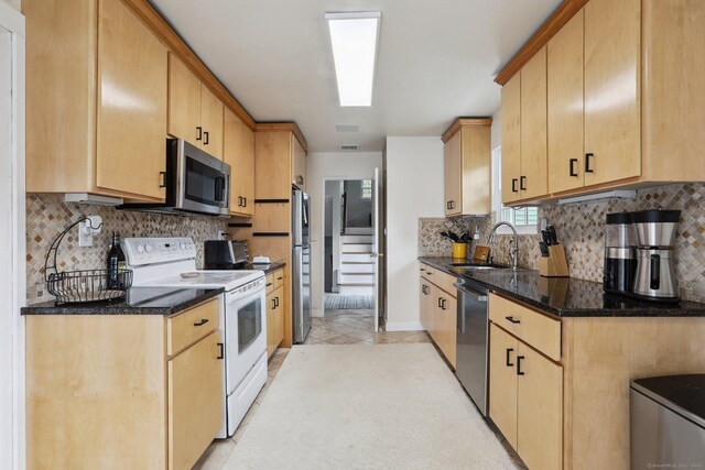 42 Stonecrop Rd, Norwalk, CT 06851 - kitchen featuring light brown cabinetry, appliances with stainless steel finishes, dark stone counters, and a sink