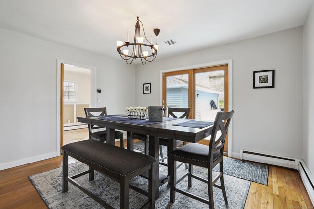 42 Stonecrop Rd, Norwalk, CT 06851 - dining area featuring a chandelier, baseboards, visible vents, and baseboard heating