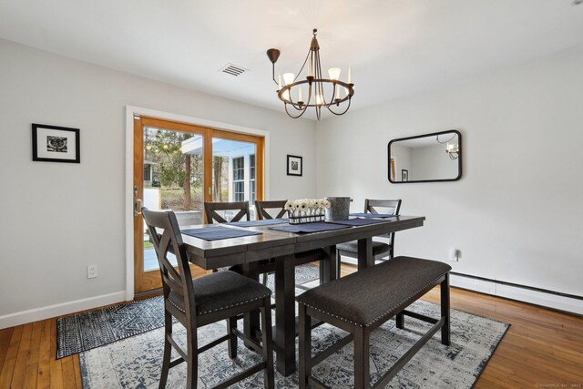 42 Stonecrop Rd, Norwalk, CT 06851 - dining area with light wood-type flooring, baseboards, visible vents, a notable chandelier, and baseboard heating
