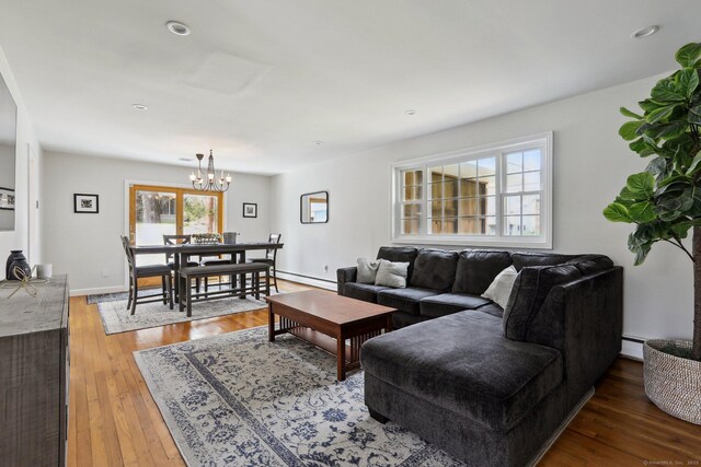 42 Stonecrop Rd, Norwalk, CT 06851 - living area featuring a baseboard heating unit, hardwood / wood-style flooring, a chandelier, and recessed lighting