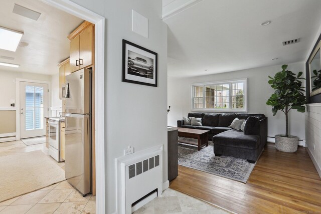 42 Stonecrop Rd, Norwalk, CT 06851 - hall featuring a baseboard radiator, radiator heating unit, visible vents, and light wood-type flooring
