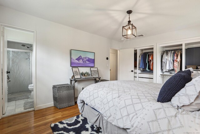 42 Stonecrop Rd, Norwalk, CT 06851 - bedroom featuring wood finished floors, connected bathroom, multiple closets, baseboards, and visible vents