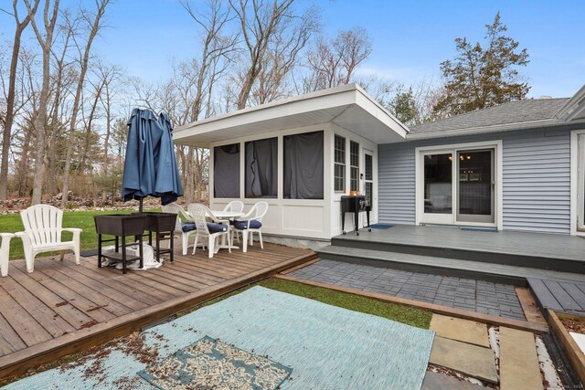 42 Stonecrop Rd, Norwalk, CT 06851 - back of house featuring a wooden deck, a patio area, outdoor dining space, and a sunroom