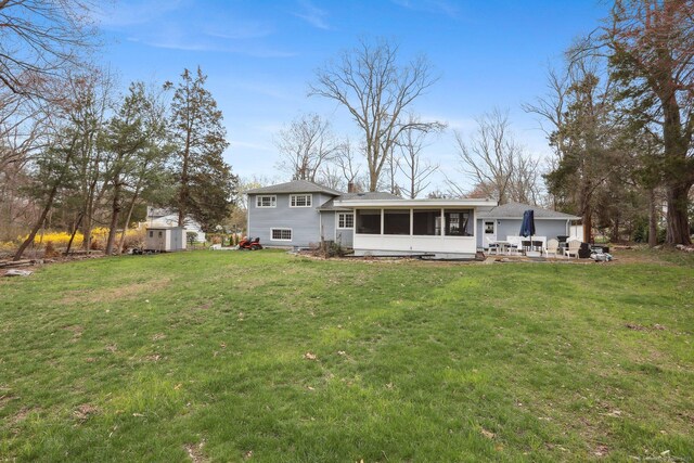42 Stonecrop Rd, Norwalk, CT 06851 - rear view of house featuring a chimney, an outdoor structure, a yard, a sunroom, and a shed