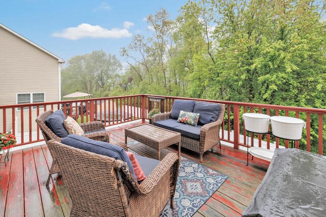 wooden deck with an outdoor hangout area