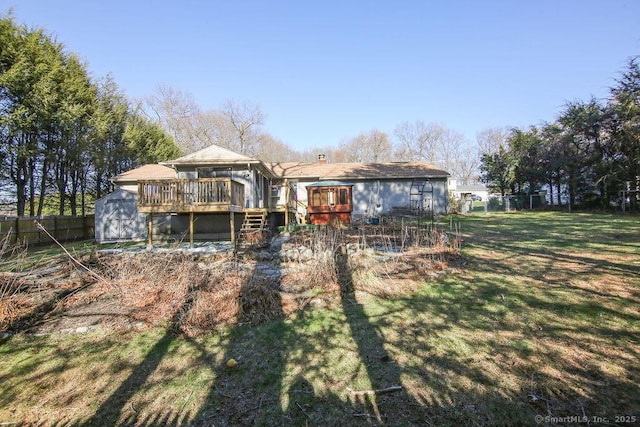 20 Sims Rd, Bristol, CT 06010 - rear view of property with fence, a storage shed, a yard, a wooden deck, and an outdoor structure