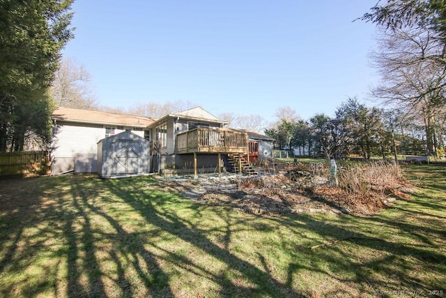 20 Sims Rd, Bristol, CT 06010 - rear view of house featuring a storage unit, an outbuilding, a wooden deck, stairway, and a yard